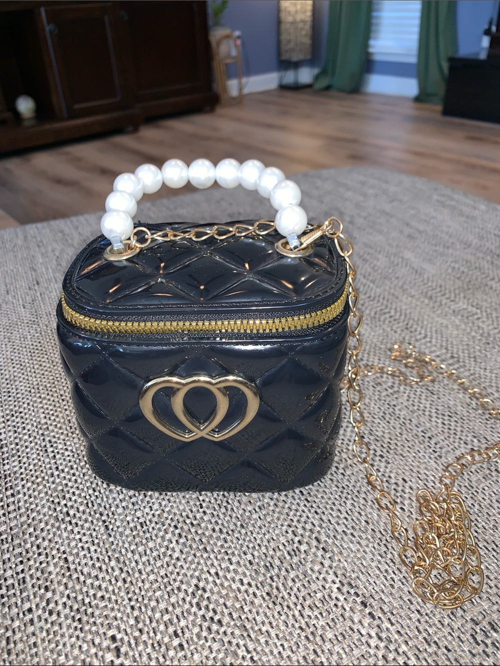 Black quilted mini jelly handbag crossbody featuring a faux-pearl top handle
